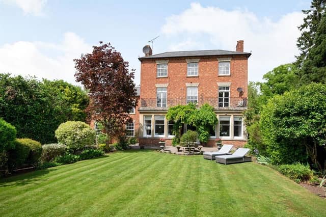 This Victorian home has a tennis court, huge gardens and a private mooring on the River Nene.