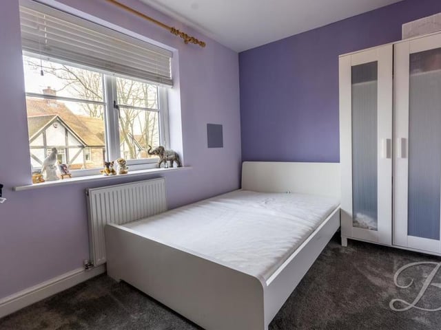 Like all the bedrooms, the fourth is a good size. The floor is carpeted, and the window overlooks the front of the house.