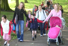 Cedar Road Primary School pupils, parents and staff walking from Abington Park playground to school as part of 'Walk To School' week.