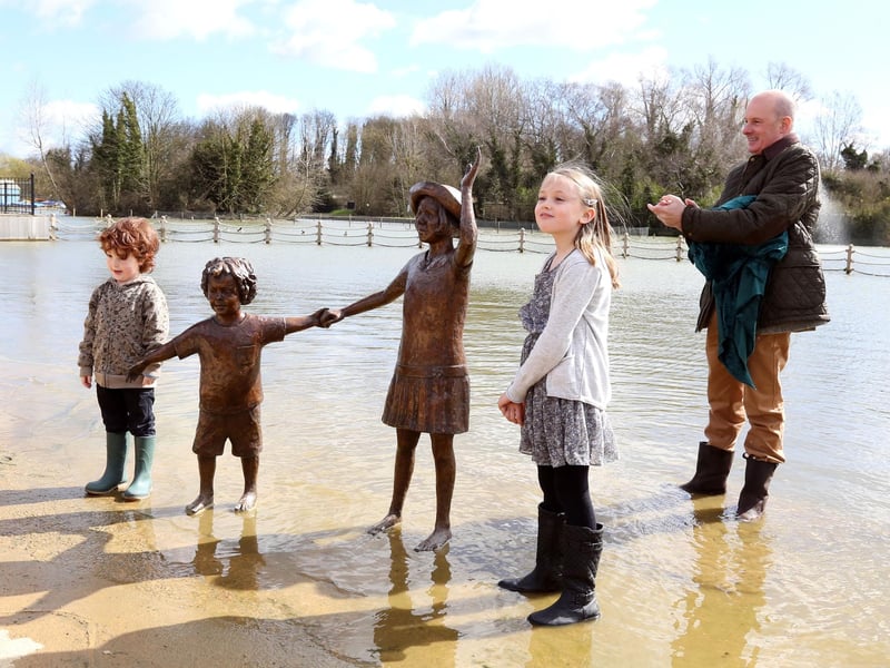 Wicksteed Statues: Kettering: Wicksteed Park lake restoration project finished with final unveiling of the statue of children by the children who posed for the sculpture. Victor Groves, 5, and Megan Phillips, 9, unveiled the sculpture helped by Oliver Wicksteed (chairman of Wicksteed Charitable Trust) March 31 2015