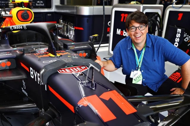Comedian Michael McIntyre gets up close and personal with the Red Bull driven by Sergio Perez