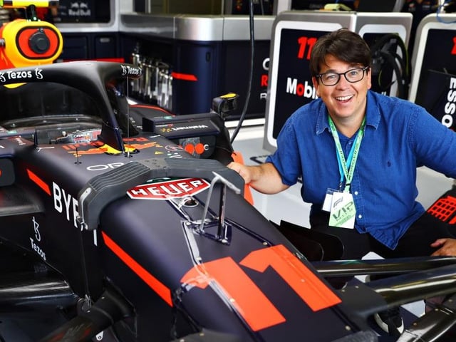 Comedian Michael McIntyre gets up close and personal with the Red Bull driven by Sergio Perez