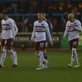 Shaun McWilliams is joined by his team-mates after breaking the deadlock for Cobblers against Carlisle United on Saturday.
