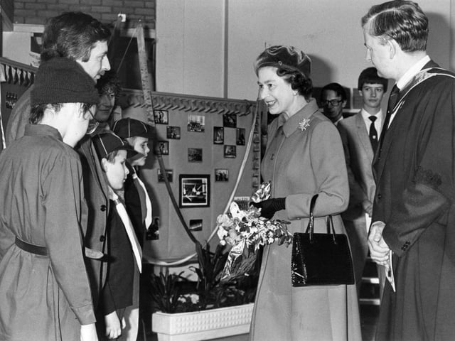 The Queen in Corby for the naming of Queen Elizabeth School. The Queen meets a party of blind pupils from Rushton Hall School accompanied by QE School's headmaster John Sutton