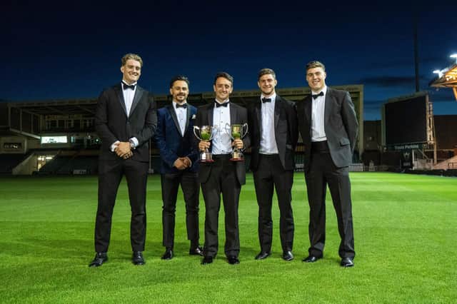 It was a special awards night for Alex Mitchell (centre) as he and four other Saints Academy graduates grabbed the big prizes