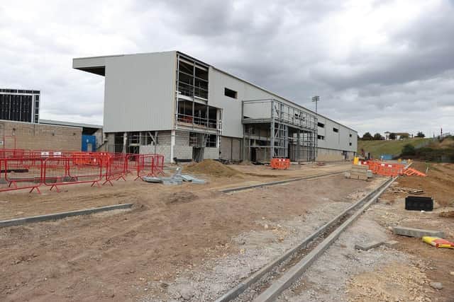 Most of the cladding has now gone up and progress is being made on the road that will go behind the stand