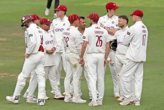 Yuzi Chahal is surrounded by his Northants team-mates after claiming one of his four wickets (Picture: Peter Short)