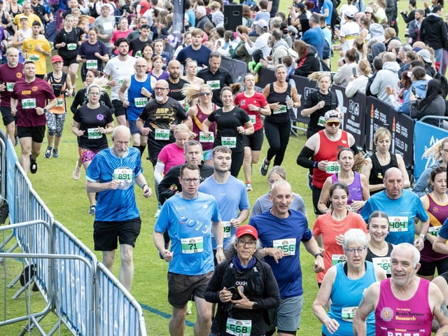 Hundreds of runners braved showers and wind to take on the race on Sunday (May 25), which started and finished at Sixfields stadium.
