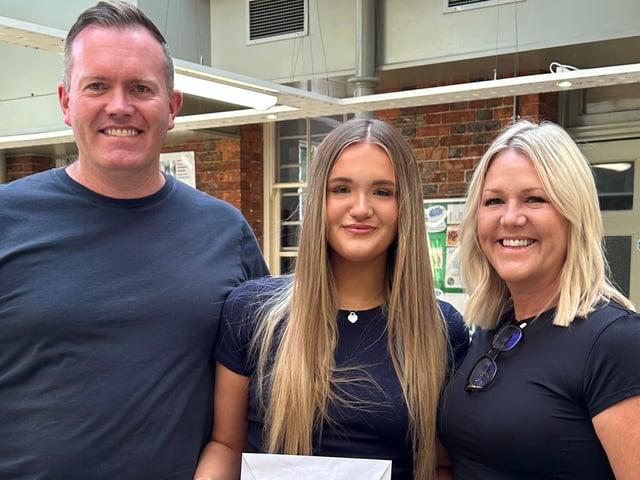 Students celebrate their A Level results with their families at QHS.