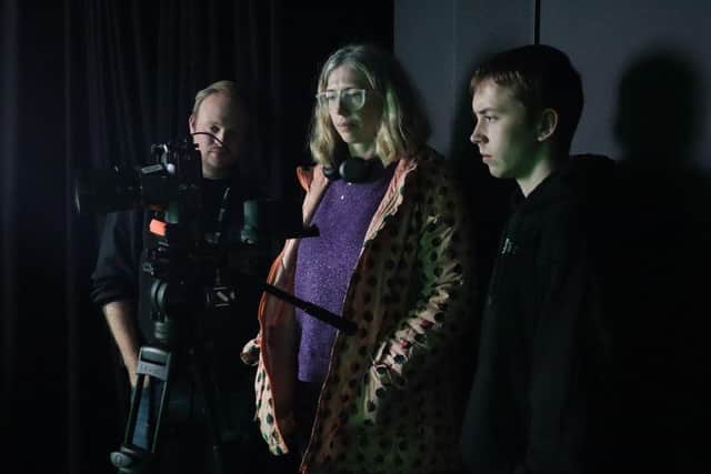 Representative Eleanor Sier, of Delapre Abbey, reviews the footage.
