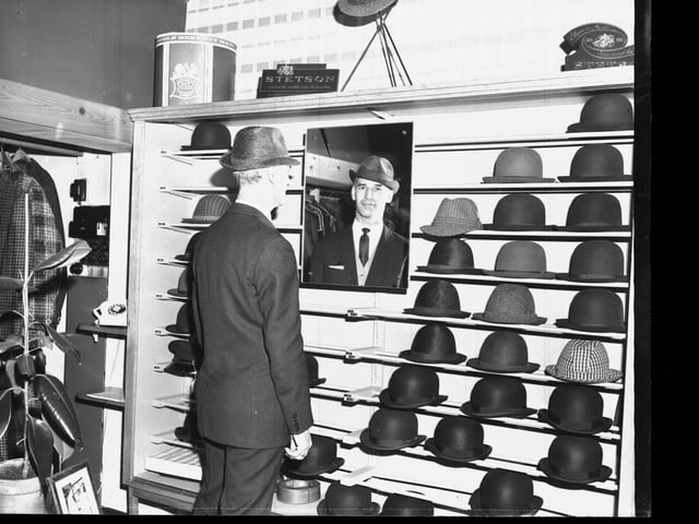 A hat for every occasion, this customer tries on a new hat