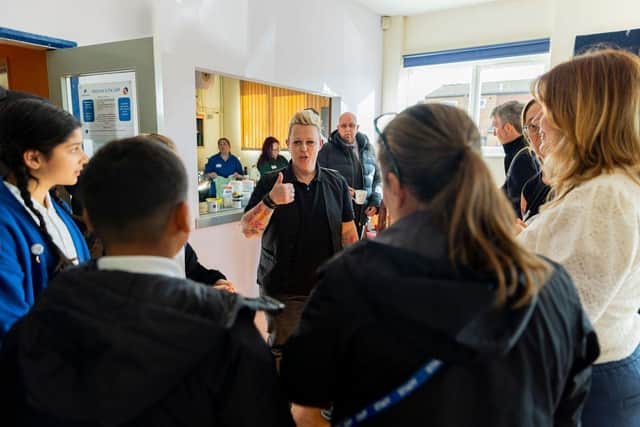 Fletch teaches schoolchildren to sign song