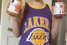 Myles holding his vitamins