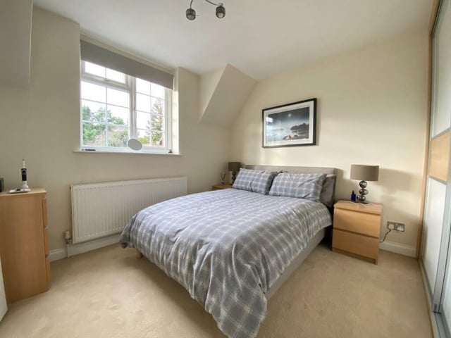 A second double bedroom ushers in light from multiple windows