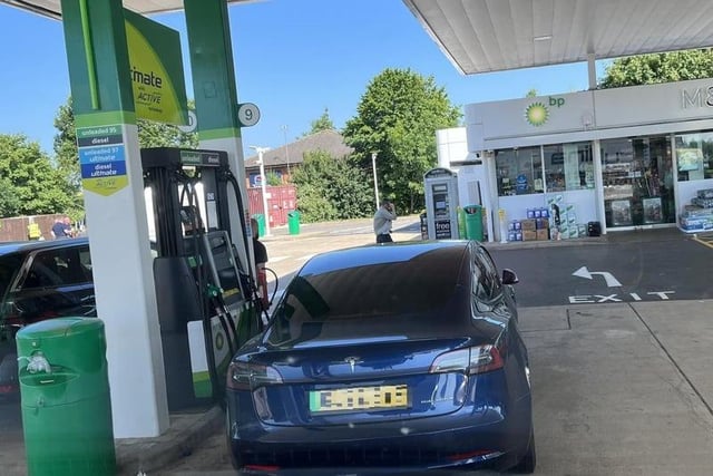 'All pumps being used and this intelligent human parks here to go inside and get some shopping.' 'Typical Tesla driver.'