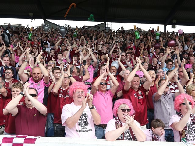 2016: Northampton Town fans welcome there team on the pitch prior to the Sky Bet League Two match between Portsmouth and Northampton Town at Fratton Park on May 7, 2016 in Portsmouth, England. (Photo by Pete Norton/Getty Images)