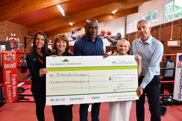 BN - Kate and Alexfrom Barratt Homes presenting Frank Bruno and other members of his foundation with