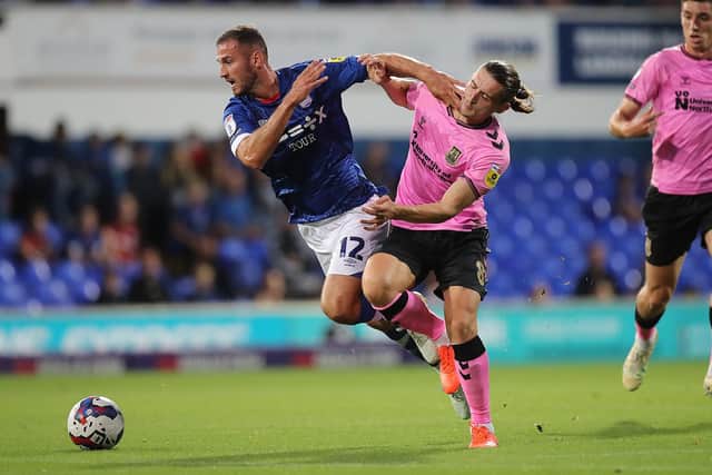 Ben Fox battles for possession during the Cobblers' Papa John's Trophy defeat at Ipswich Town (Pictures: Pete Norton)