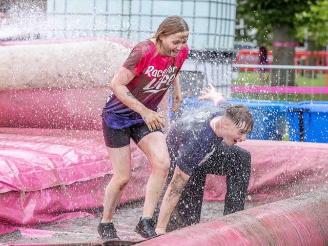 All smiles as participants tackled obstacles during Race for Life's Pretty Muddy on Saturday July 13, 2024 in Abington Park.