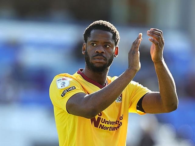 The Man City loanee applauds the travelling support after an immense display at the back