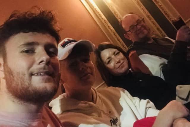 Luke with brother Jake and mum Julie and dad Richard