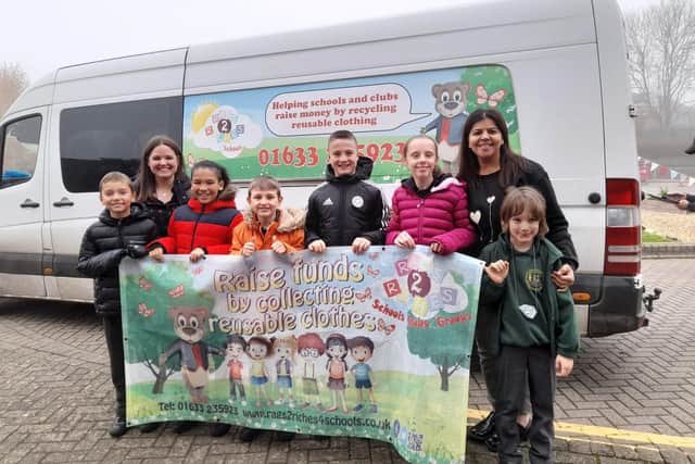 Kat Pennington (Head) Indy Jutla (Chair of PTA) and children from East Hunsbury Primary School go green and raise £127.20 for their school.