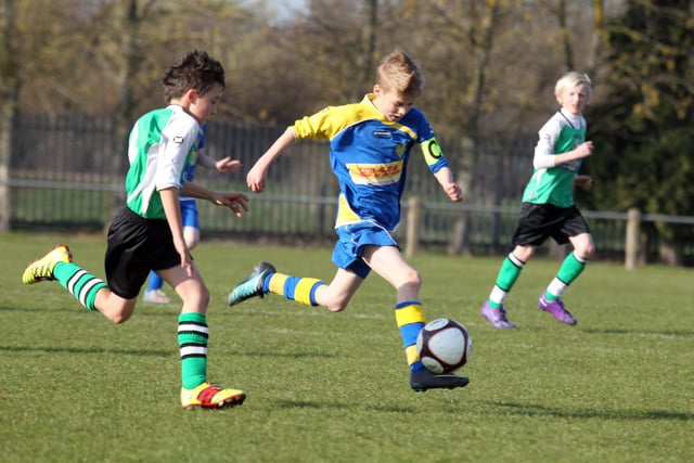 Action from NTFA All Weather Cup under 11 between Grange Park Rangers and Towcester Town at Studland Road