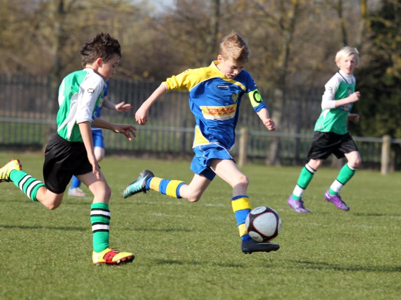Action from NTFA All Weather Cup under 11 between Grange Park Rangers and Towcester Town at Studland Road