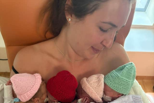 Jodie's first cuddle with all four babies, at six weeks old. Photo: