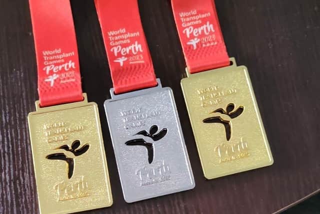 The first three medals won by Karen Rockell at the World Transplant Games in Perth on Tuesday. Two more were won on Wednesday.