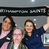 Northampton Saints supporter Louise Elmore with Adina Paduraru and Martine Ratcliffe, staff at Longueville Court Care Home (image: David Lowndes)