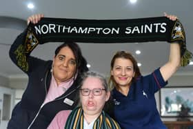 Northampton Saints supporter Louise Elmore with Adina Paduraru and Martine Ratcliffe, staff at Longueville Court Care Home (image: David Lowndes)
