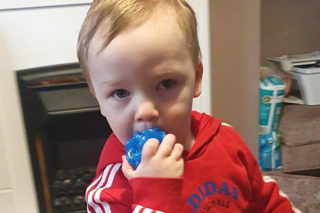 Charlie, aged 2 wearing red for nursery. Kelly said: "Charlie has autism so he's unaware but luckily his favourite top is red."