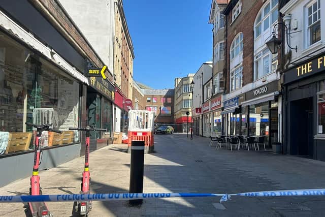 Three people have been charged with attempted murder after a stabbing in Abington Street.
