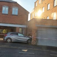 Mercedes car smashes into wall of a building in busy Northampton road