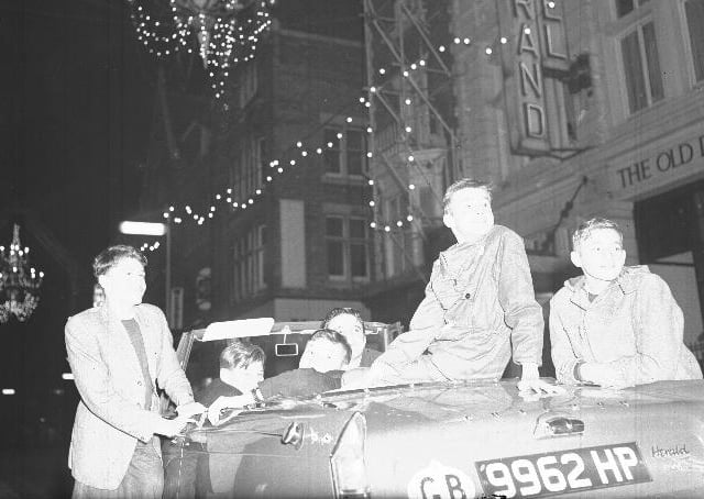 Christmas decorations in Gold Street, Northampton youths in a Triumph Herald 12/50 Convertible, date unknown