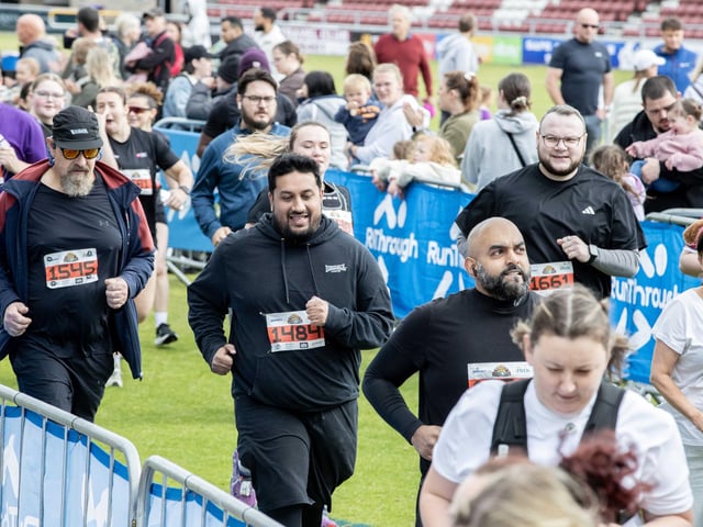 Hundreds of runners braved showers and wind to take on the race on Sunday (May 25), which started and finished at Sixfields stadium.
