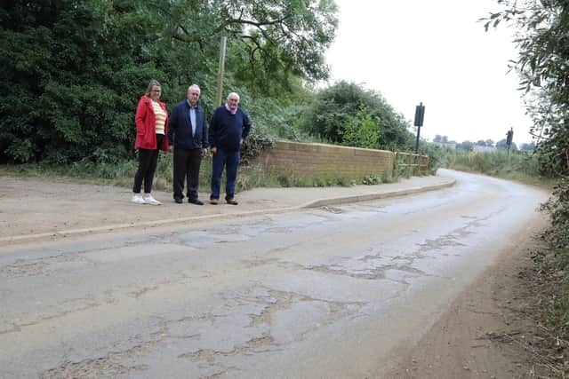 L-r Rosemary Smart (clerk to Earls Barton Parish Council), Cllr Martin Griffiths, John Dunkley by the bridge in Station Road, Earls Barton/ National World