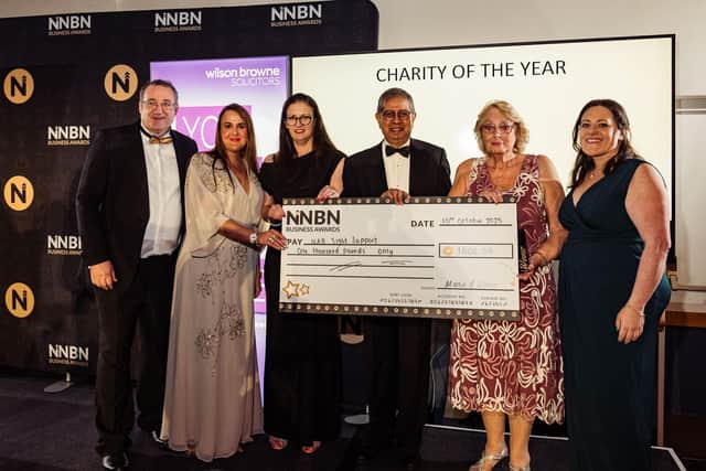 NAB Trustees Sue and Fiz are presented a cheque for £1,000 from NNBN.