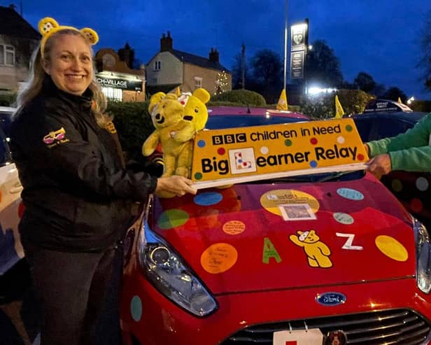 Pictured is Adrian Spires, of Gunner Pass driving school, being given the Children in Need top box to lead their convoy from Weedon to Nuneaton.