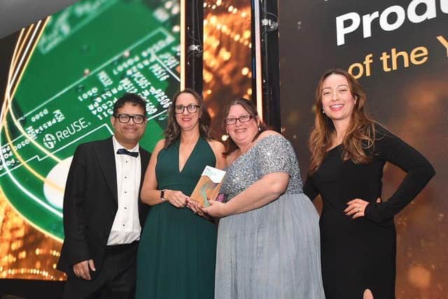 Emma Armstrong (second left) proudly displays award