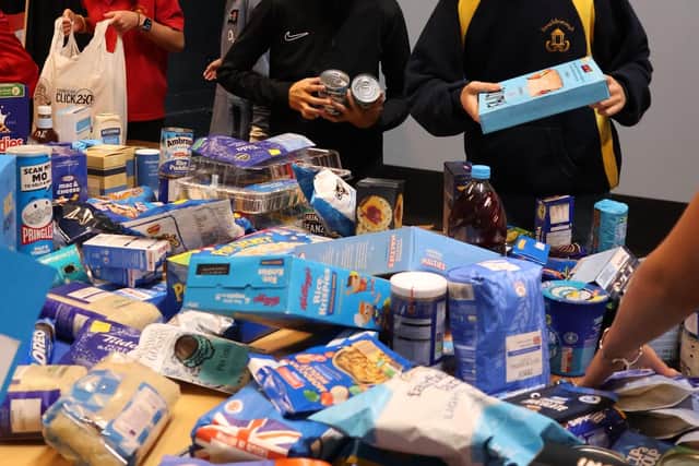 Beachborough students packing up food donations to deliver to Brackley Foodbank