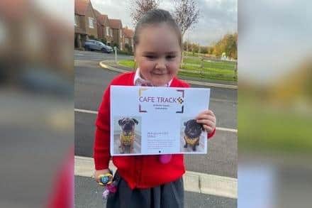 Five-year-old Ellysia-Rose, who was diagnosed with autism just last month and has a passion for dogs, was delighted to be gifted one of Michelle's calendars.