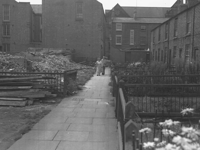Elderly couple survey demolition site