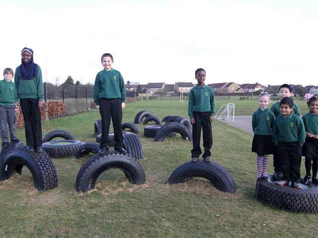 Children from Green Oaks Primary School in their new tyre park next to the school playground.