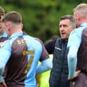 Jon Brady talks to his players during Saturday's friendly with Nottingham Forest.