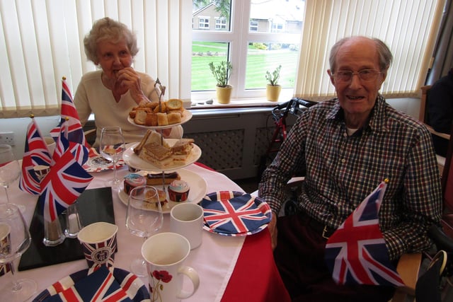 Two residents Gillian and Tony enjoying their Coronation Day Afternoon Tea