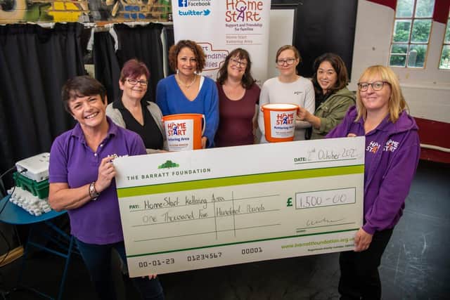 B&amp;DWC - SGB-15177 - Home-Start Kettering receiving their cheque from Barratt and David Wilson Homes