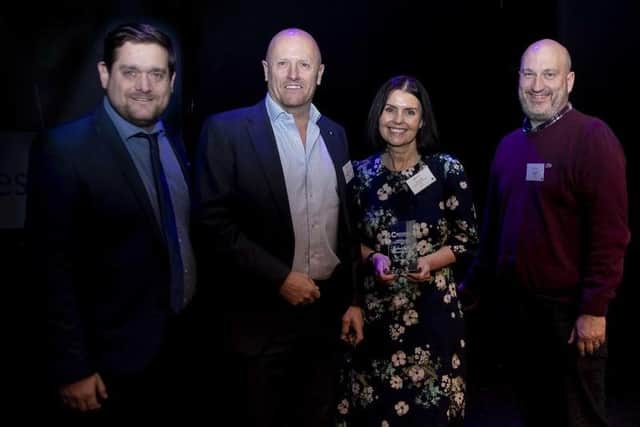 Representatives from Northants Litter Wombles accepting the group's award at the Northamptonshire Community Foundation Awards 2022. Photo: Kirsty Edmonds.