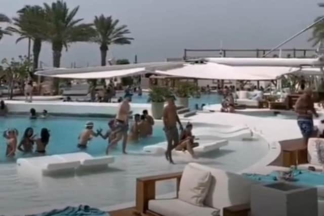 A screenshot of a video posted by Delgado at a beach club in Dubai.